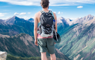 Men in mountains watching landscape